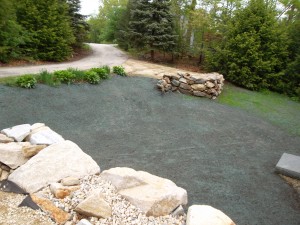 New driveway, rock retaining walls, granite steps, granite landing, and hydro-seed in Raymond, NH